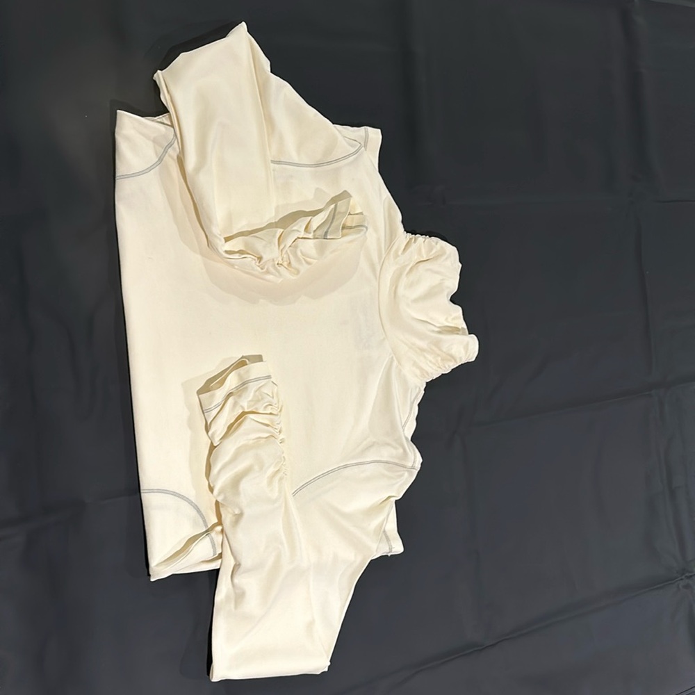 Lovely cream turtleneck with light grey stitching